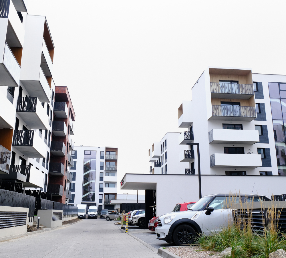 WROCLAW, POLAND - NOVEMBER, 2019.  Street of cozy courtyard of modern residential buildings district with parked cars. No people.